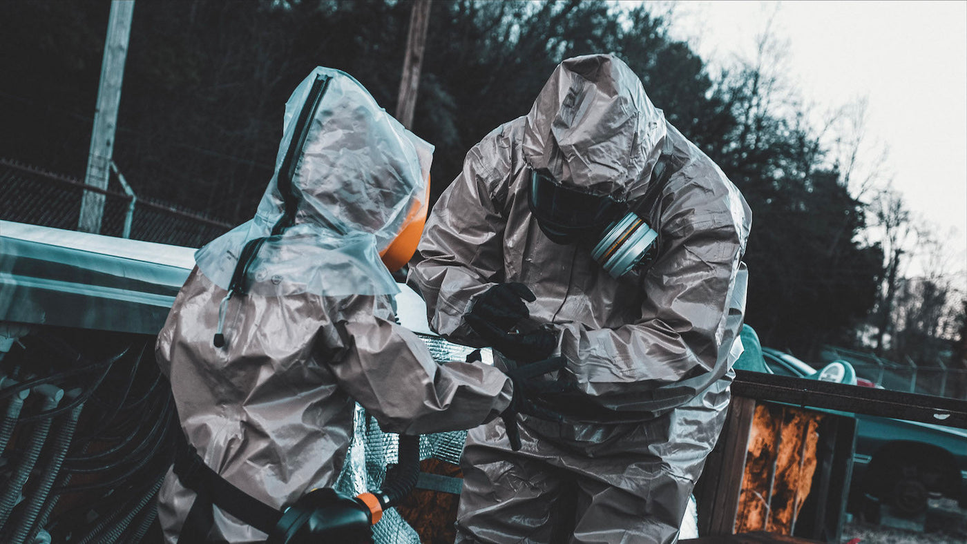 Father and child wearing full CBRN PPE