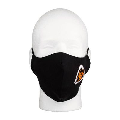 Front view of the MIRA Safety Mask with biohazard insignia on a mannequin head
