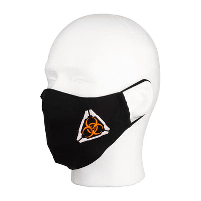 Three quarter view of the MIRA Safety Mask with biohazard insignia on a mannequin head