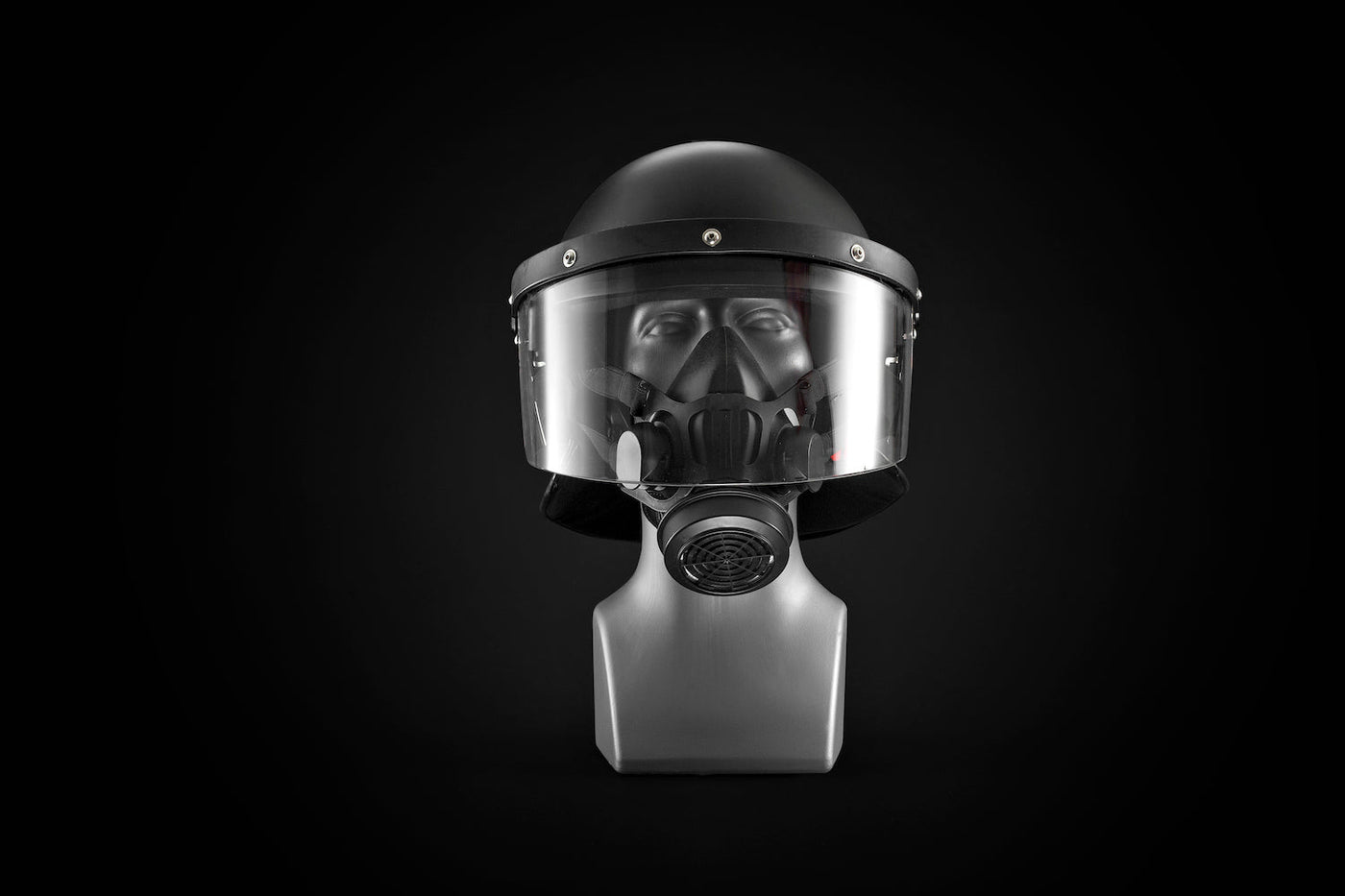 Front profile of the Tactical Air-Purifying Respirator mask (TAPR) connected to a riot control helmet