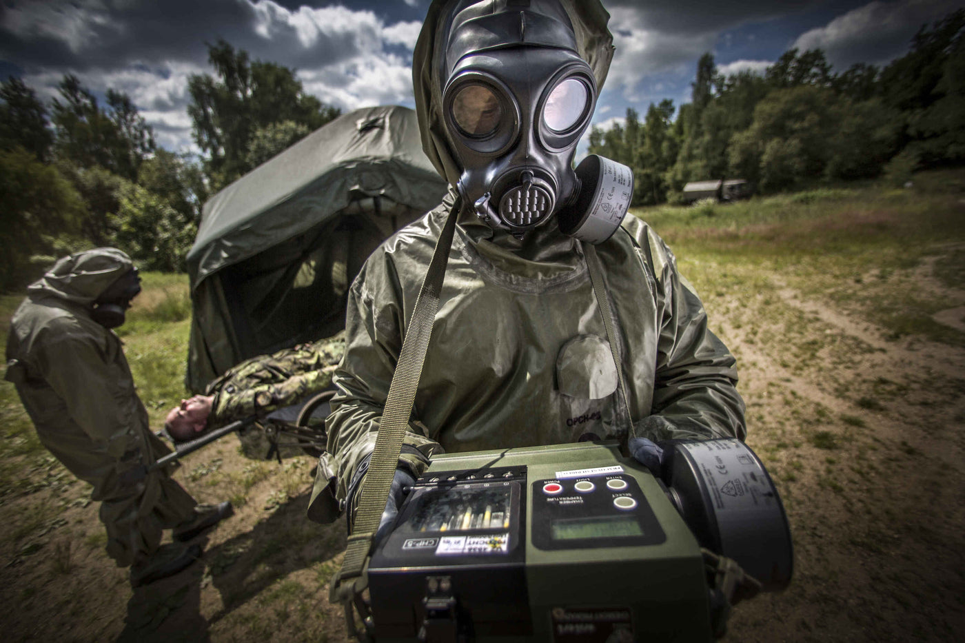 Solider testing air samples while wearing the CM-7M nuclear gas mask