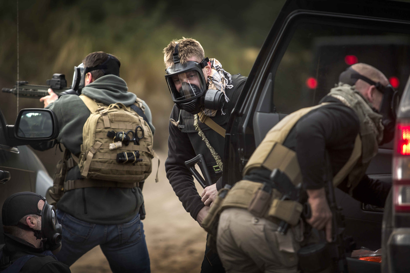 Man dressed in tactical clothing wearing the MIRA Safety CM-6M full face gas mask