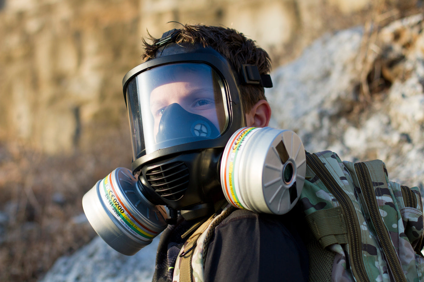 Young boy wearing the CM-6M tactical gas mask