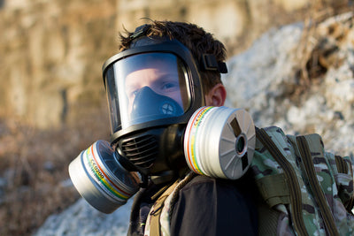 Young boy wearing the CM-6M tactical gas mask