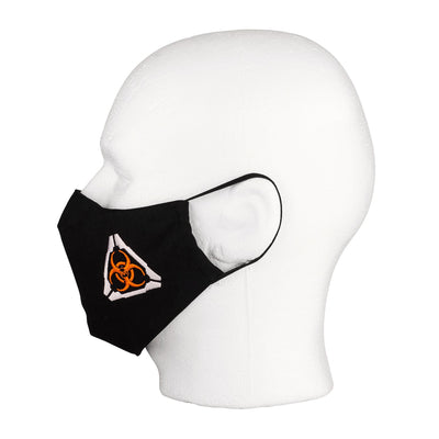 Side view of the MIRA Safety Mask with biohazard insignia on a mannequin head